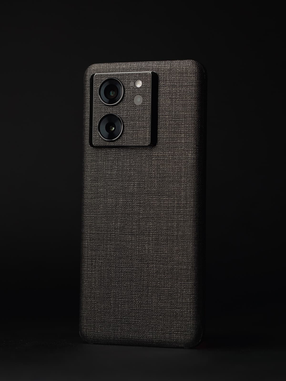 Woven skins fitted on smartphone body and camera module